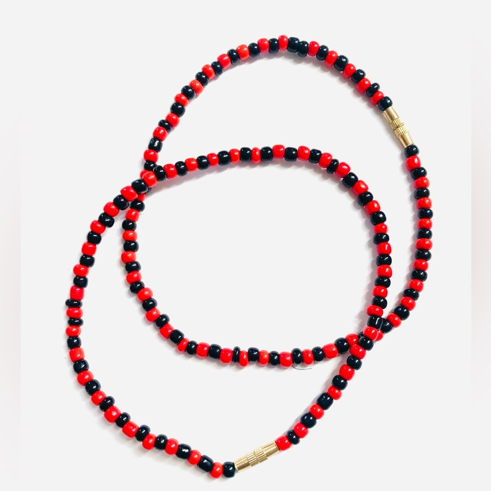 A pair of black and red Beaded anklets